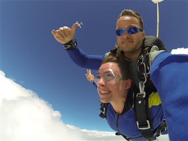 Picture of Tandem Skydiving out of an aeroplane. A Skydiver that is certified to tandem skydive will strap you in and give you the experience of the skydiving thrill. This picture was taken in Parys, South Africa.